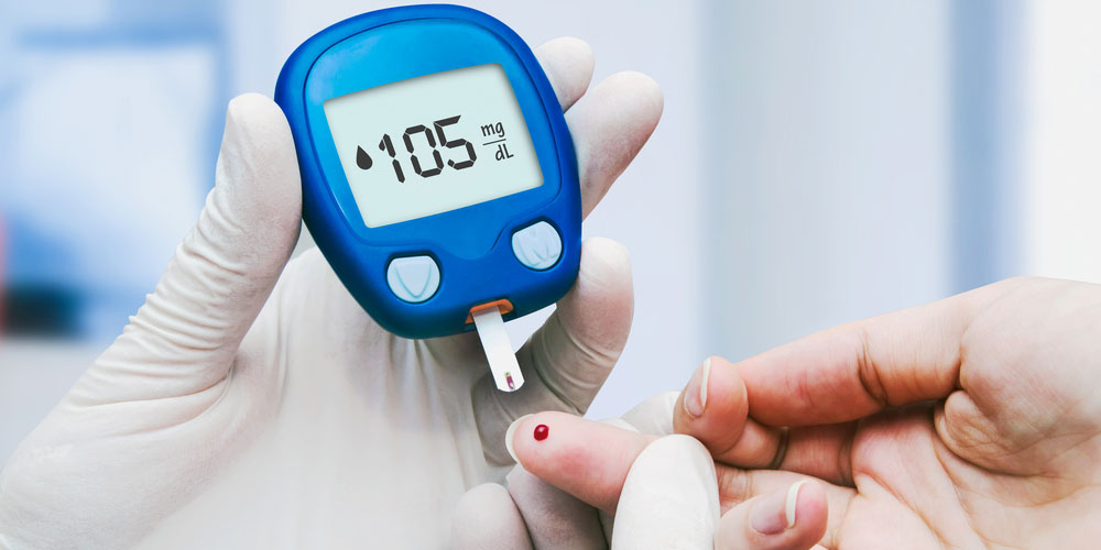 doctor-making-blood-sugar-test-in-homeopathy-clinic-for-diabetes-panvel